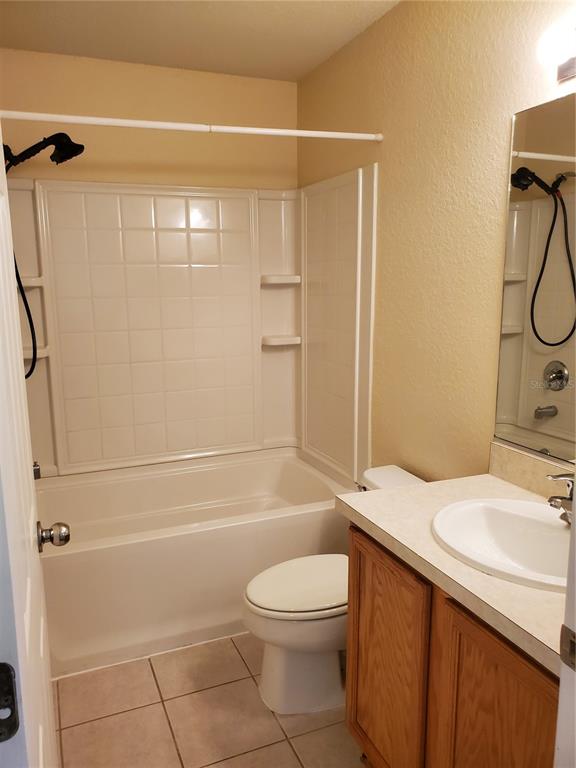 5584 Southwest 39th Street Ocala, FL 34474 - Photo 15 of 56 a bathroom with a sink a toilet and shower