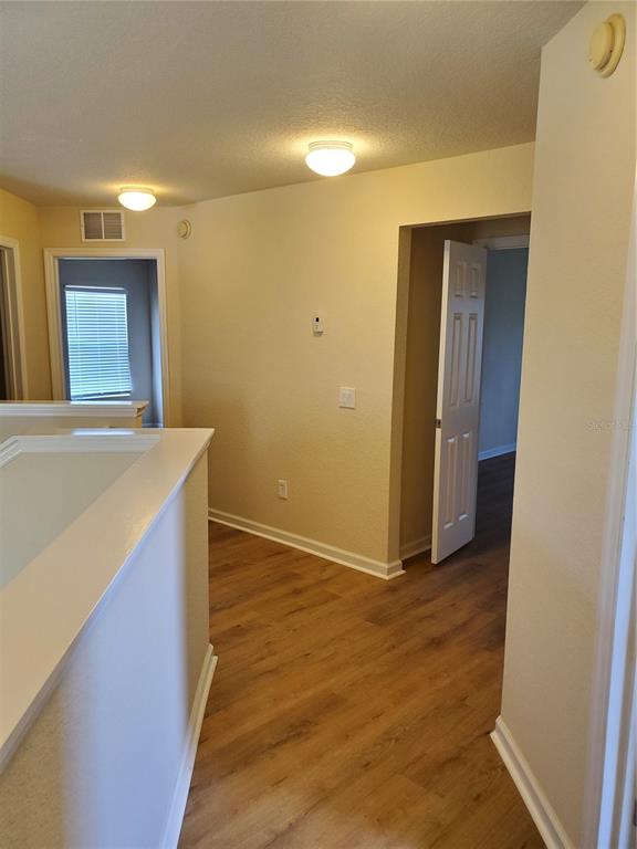 5584 Southwest 39th Street Ocala, FL 34474 - Photo 17 of 56 a view of livingroom with kitchen and hardwood
