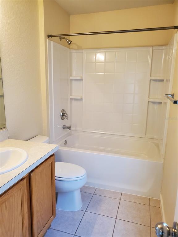 5584 Southwest 39th Street Ocala, FL 34474 - Photo 26 of 56 a bathroom with a granite countertop sink toilet and shower