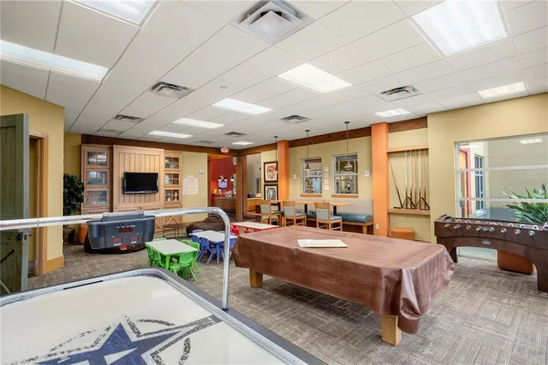 a large kitchen with cabinets and stainless steel appliances