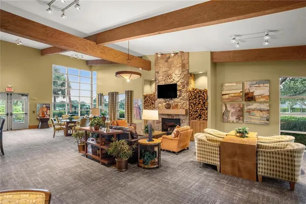 a living room with furniture and a book shelf