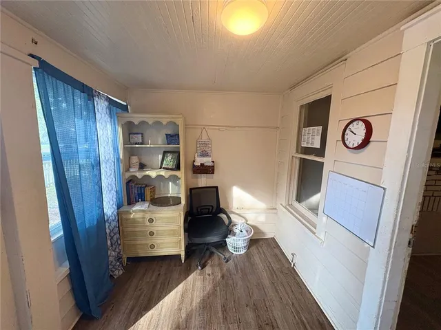 a view of kitchen and wooden floor