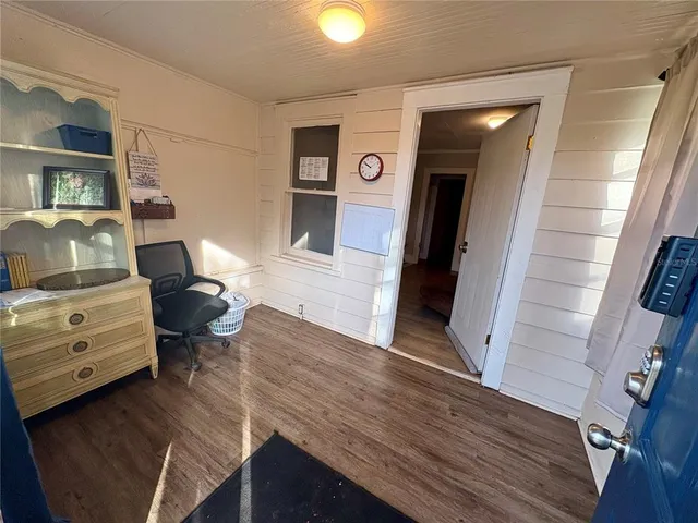 a room with furniture and wooden floor