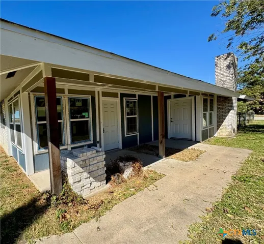 a view of a house with a patio