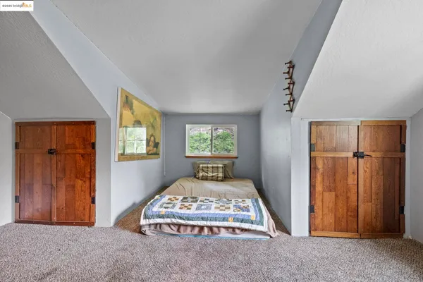 a living room with a fireplace and a window