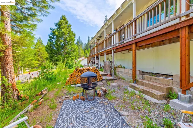 a backyard of a house with table and chairs