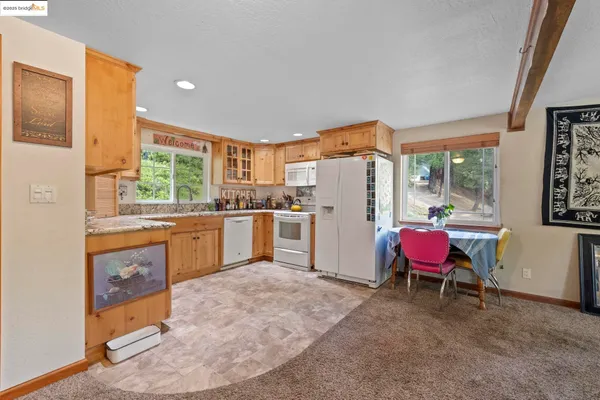 a kitchen with a sink stove and refrigerator
