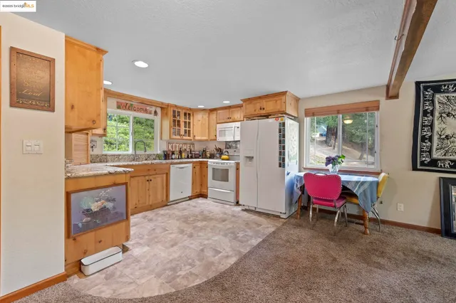 a kitchen with a sink stove and refrigerator