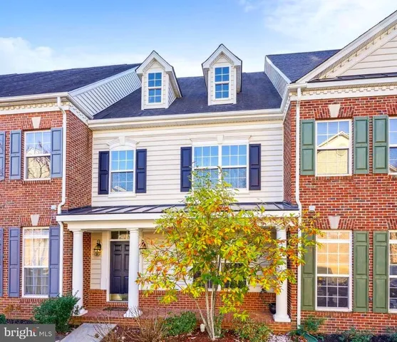 a front view of a house with large windows