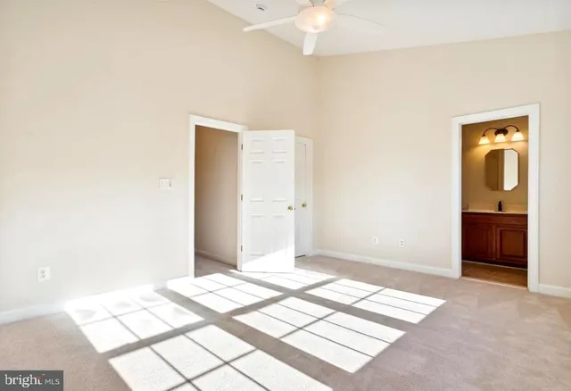 a bedroom with a bed and a mirror