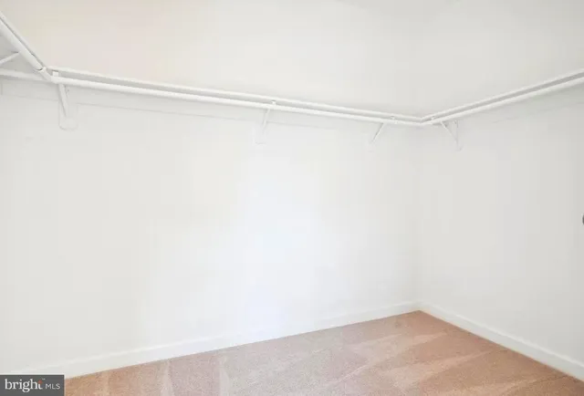 a view of a room with shelf on the wall