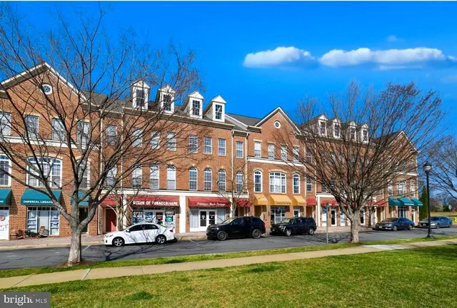 a front view of a building with garden