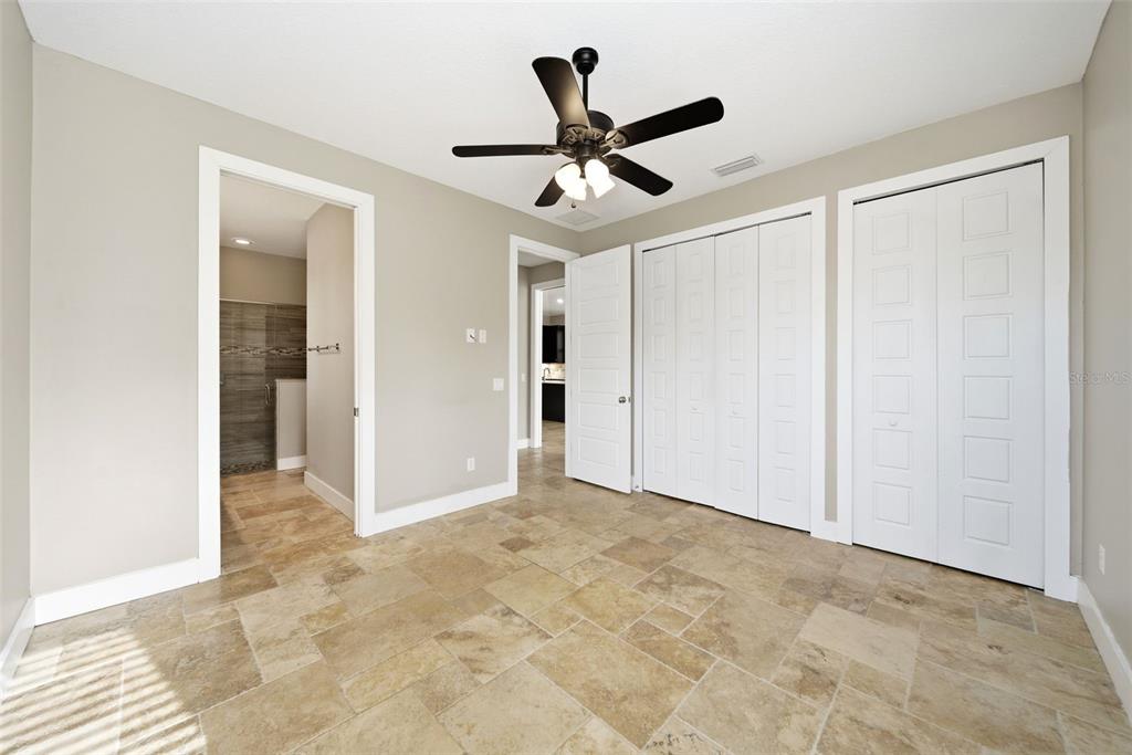 4604 North Fort Christmas Road Christmas, FL 32820 - Photo 22 of 41 a view of a livingroom with a ceiling fan & entryway