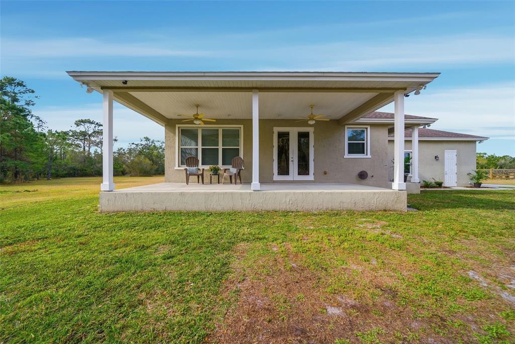 4604 North Fort Christmas Road Christmas, FL 32820 - Photo 28 of 41 front view of a house with a yard