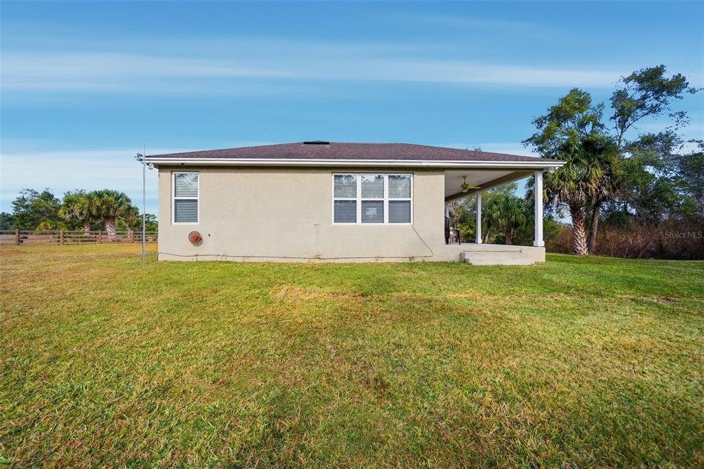 4604 North Fort Christmas Road Christmas, FL 32820 - Photo 32 of 41 a front view of house with yard and green space