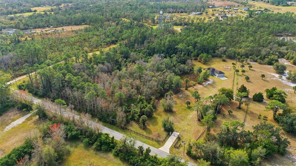 4604 North Fort Christmas Road Christmas, FL 32820 - Photo 35 of 41 an aerial view of residential houses with outdoor space and trees