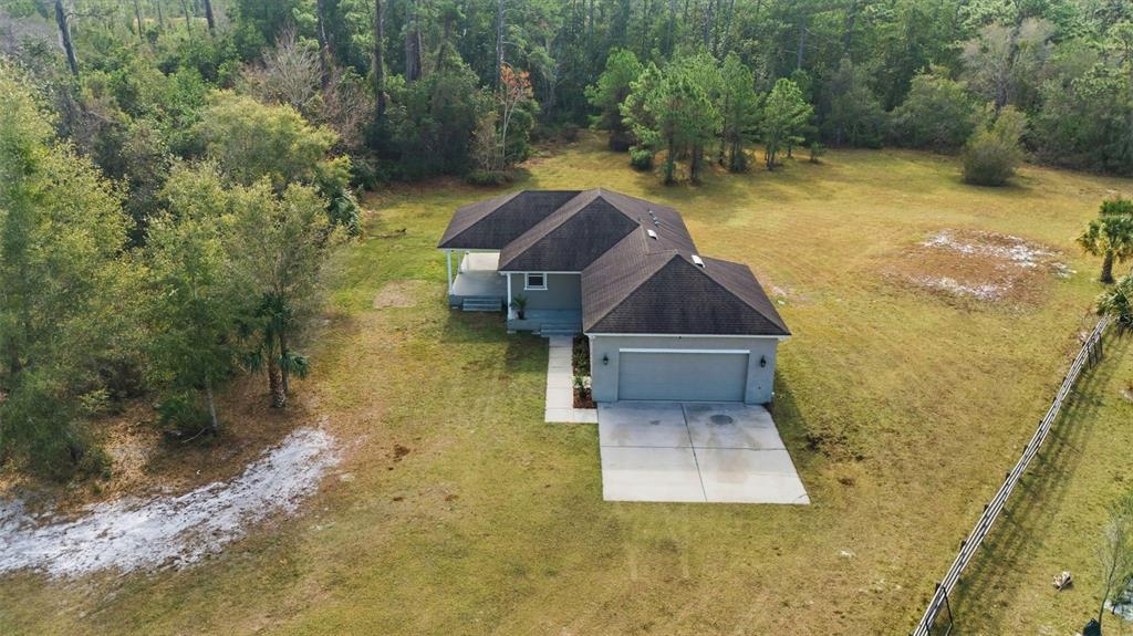 4604 North Fort Christmas Road Christmas, FL 32820 - Photo 5 of 41 a view of a yard in front of house