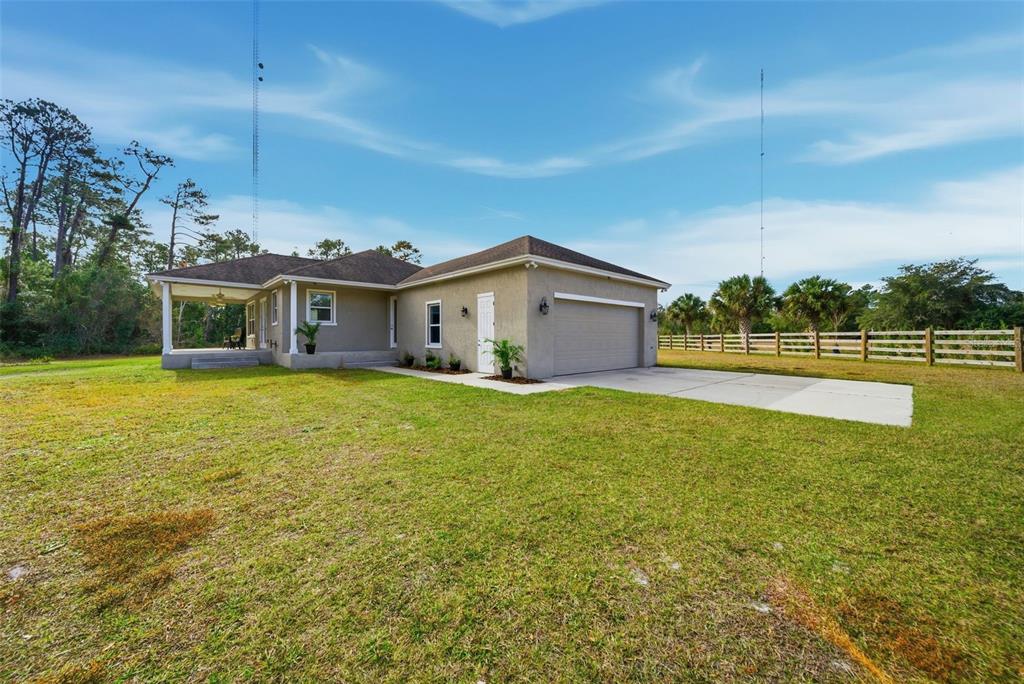 4604 North Fort Christmas Road Christmas, FL 32820 - Photo 6 of 41 a view of a house with a big yard