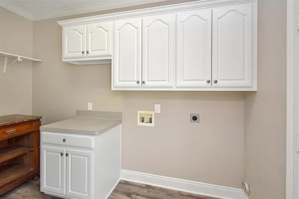 a view of cabinets with wooden floor