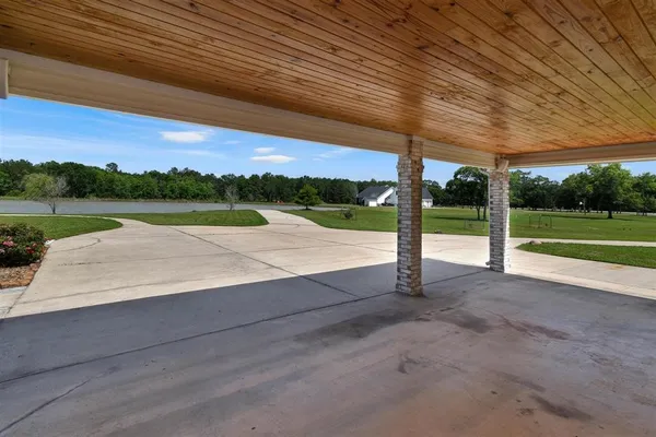 a view of a road with a big yard