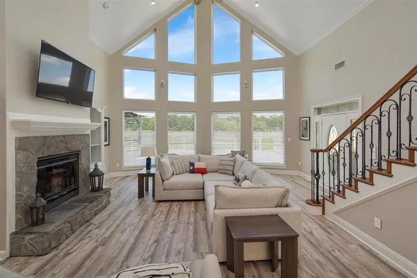 a living room with furniture fireplace and a flat screen tv