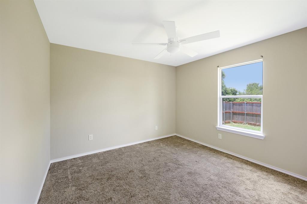 433 Whitney Court Rio Vista, TX 76093 - Photo 15 of 27 an empty room with a empty space and windows