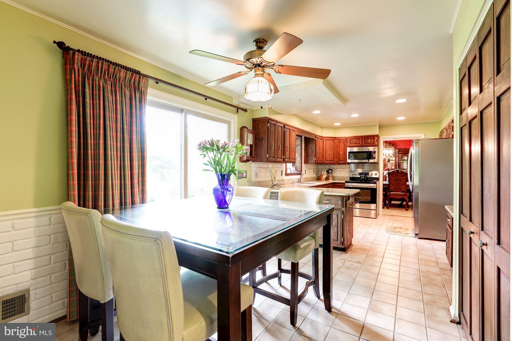 15141 Middlegate Road Silver Spring, MD 20905 - Photo 7 of 30 Charming Kitchen with Slider to Backyard Patio