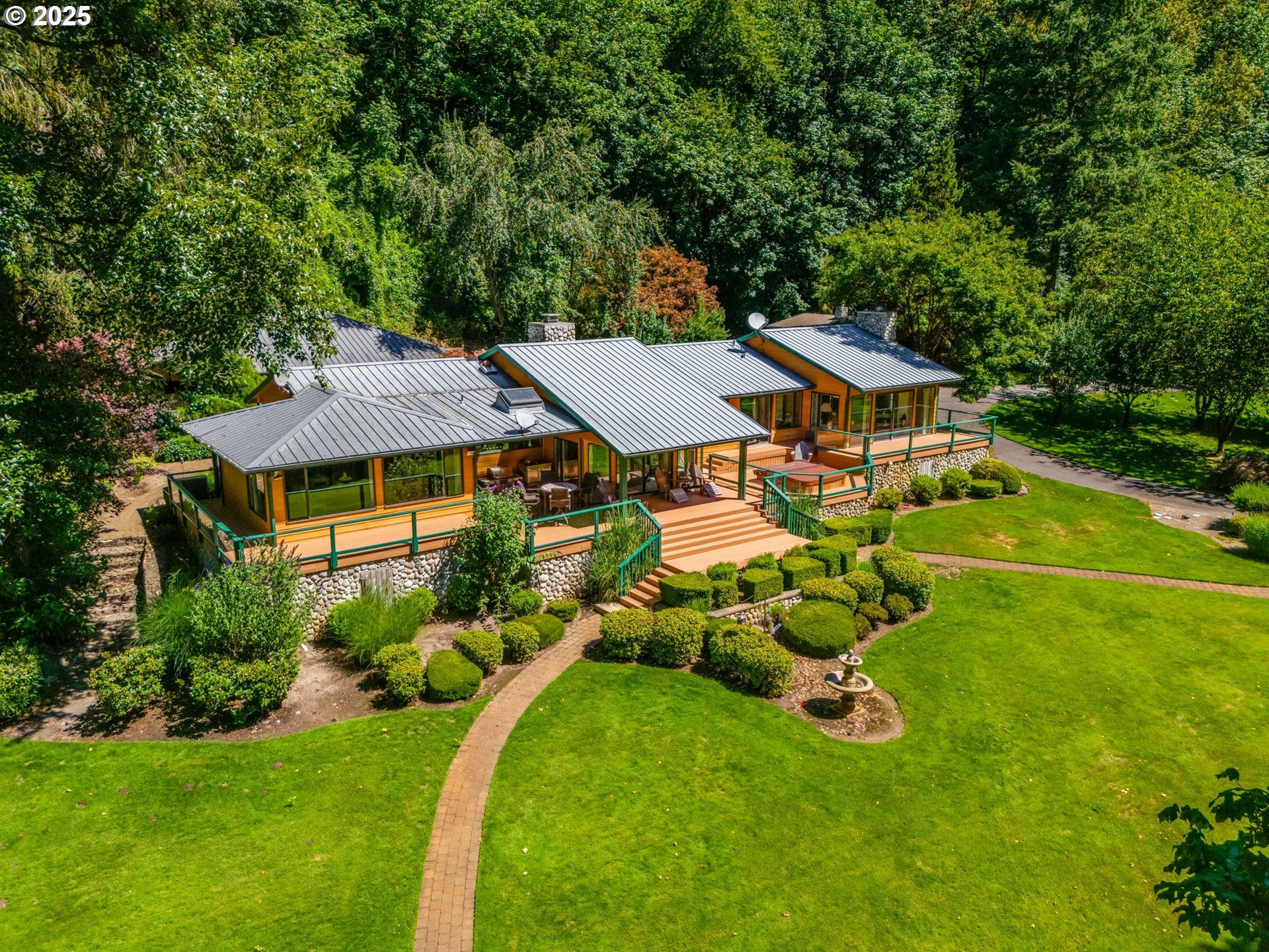 3817 Old Lewis River Road Woodland, WA 98674 - Photo 1 of 48 an aerial view of a house with swimming pool and big yard