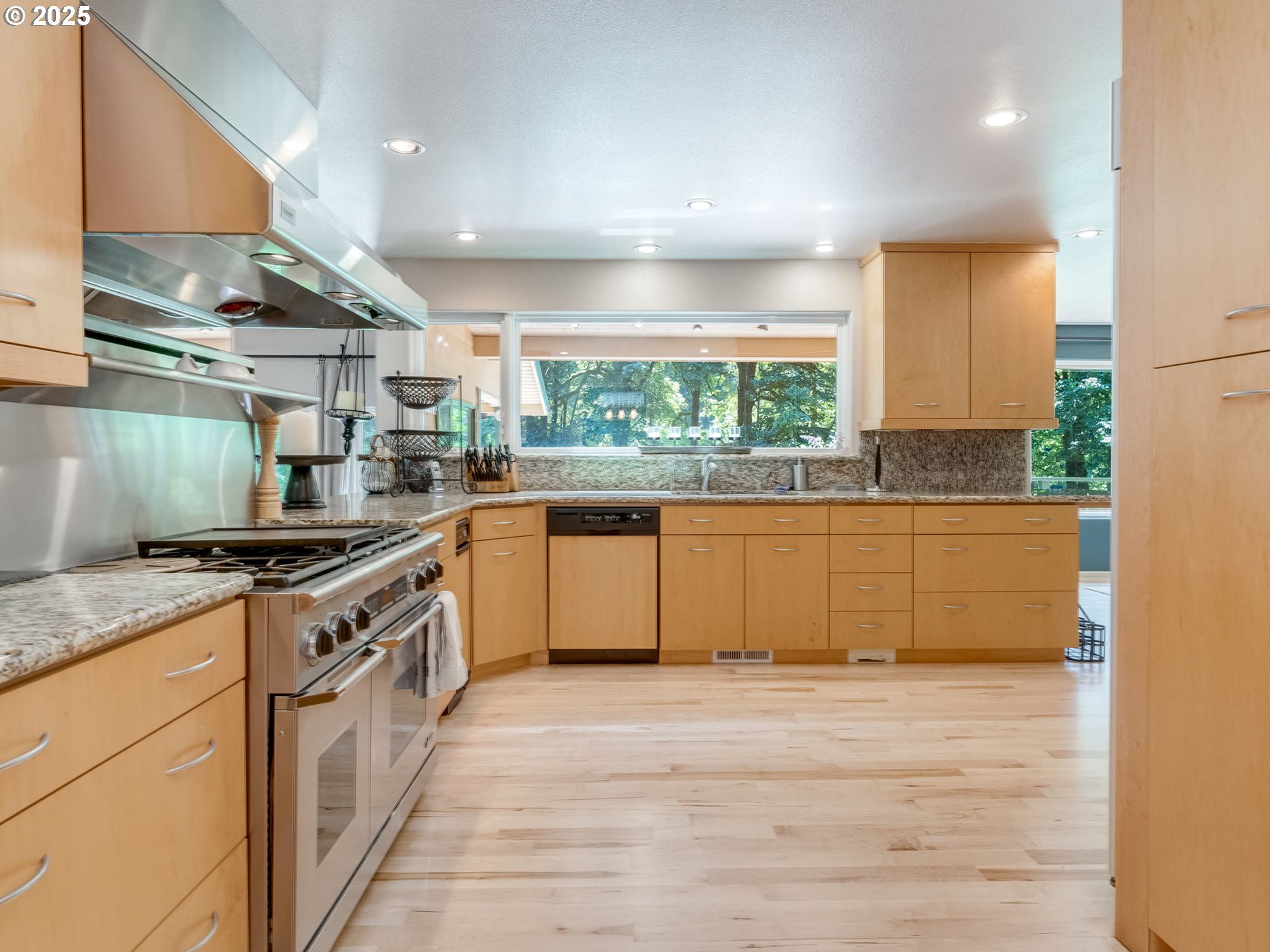3817 Old Lewis River Road Woodland, WA 98674 - Photo 12 of 48 a kitchen with stainless steel appliances granite countertop a stove a sink and a refrigerator