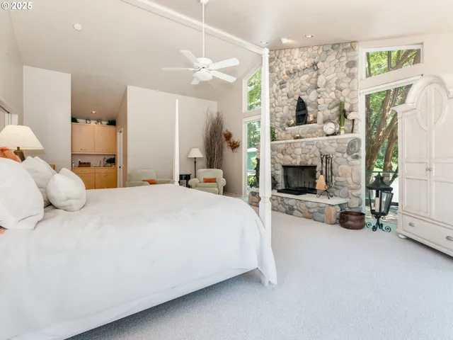 a spacious bathroom with a granite countertop sink mirror and a shower
