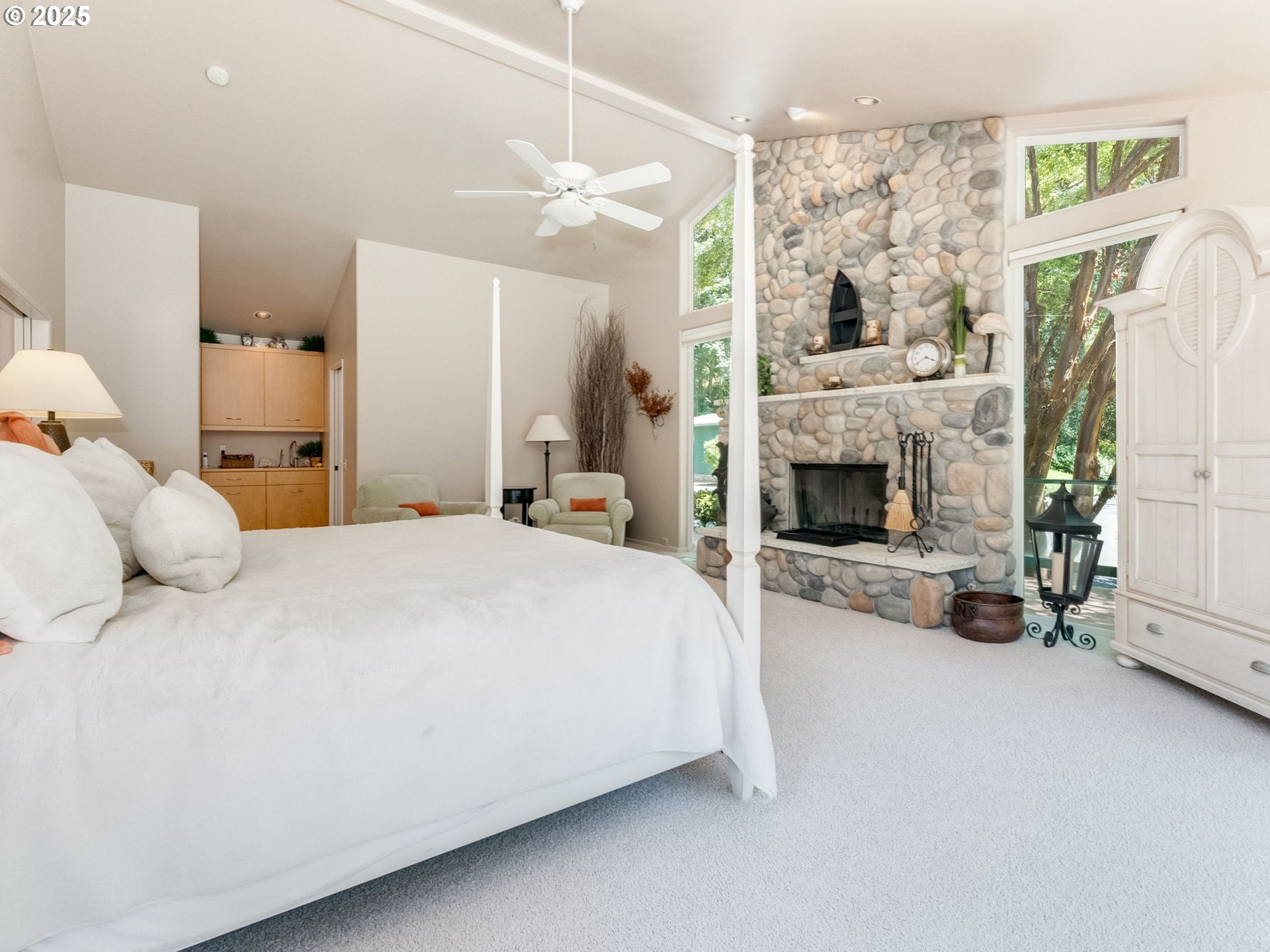 3817 Old Lewis River Road Woodland, WA 98674 - Photo 16 of 48 a bed room with a bed and a fireplace