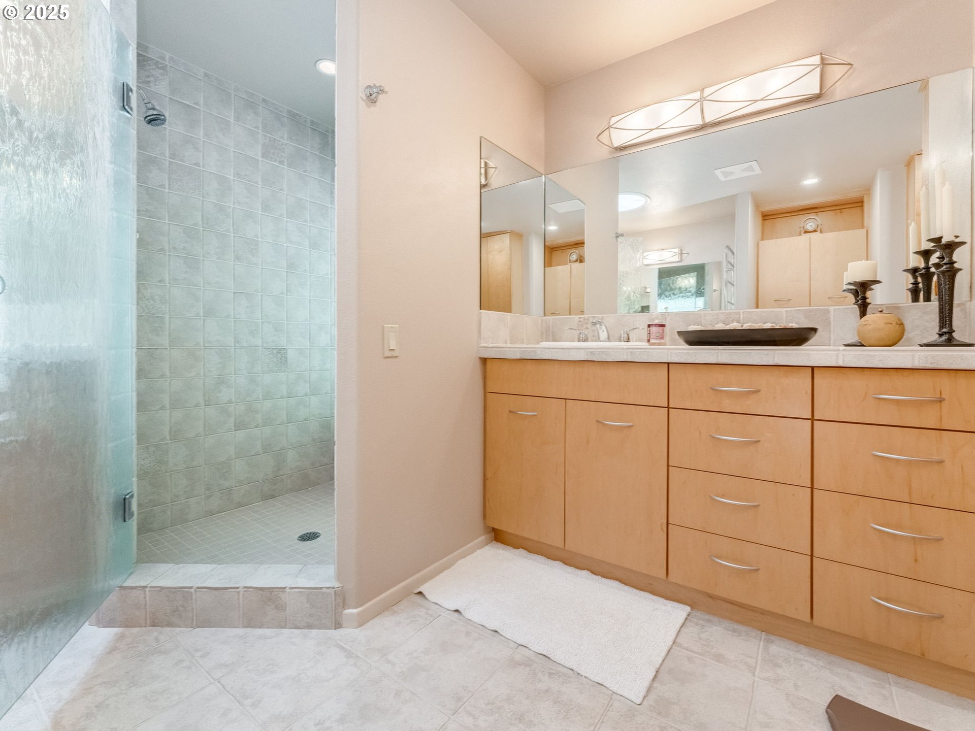 3817 Old Lewis River Road Woodland, WA 98674 - Photo 18 of 48 a bathroom with a granite countertop sink a mirror and shower