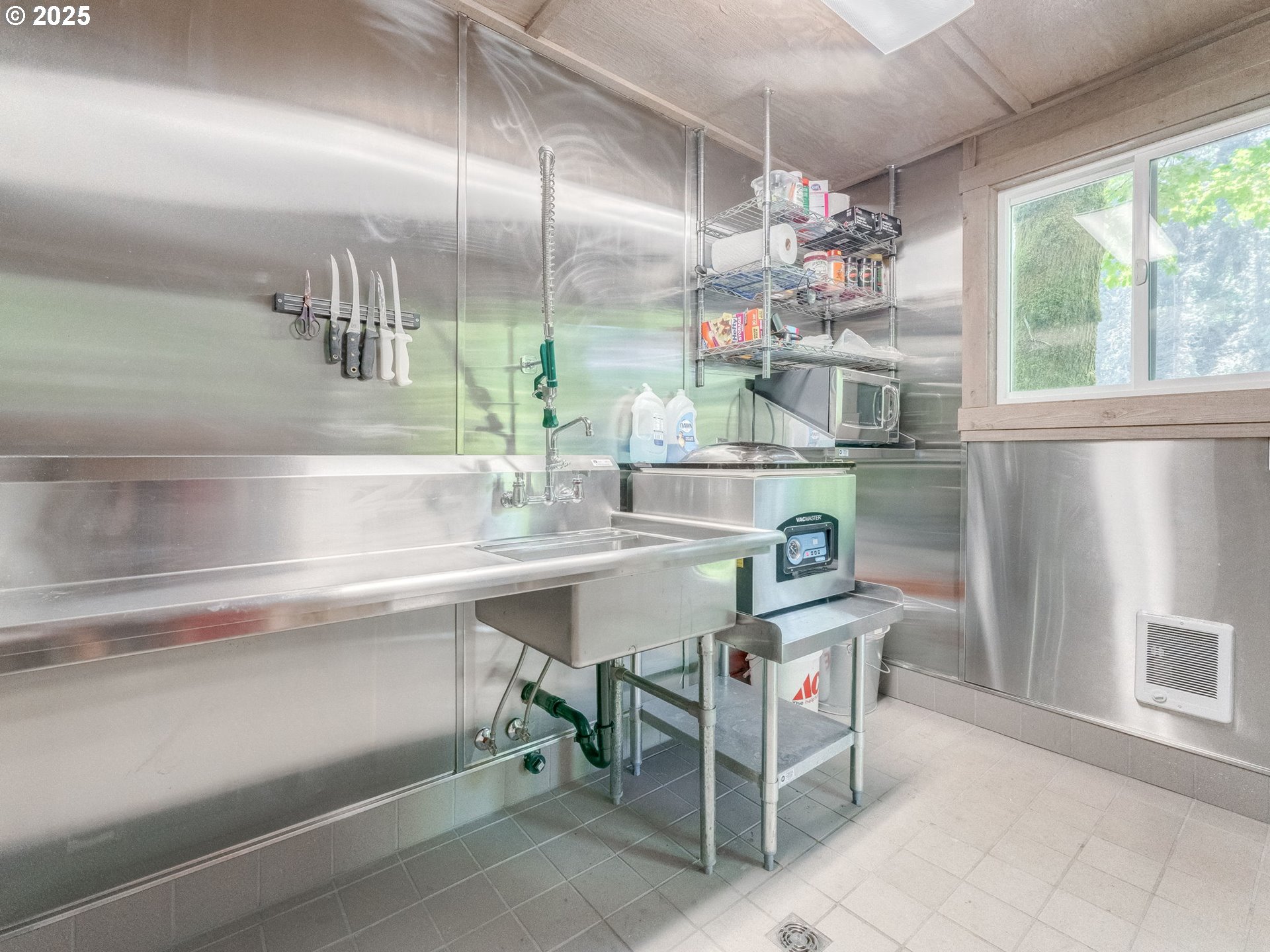 3817 Old Lewis River Road Woodland, WA 98674 - Photo 32 of 48 a kitchen with a sink and chandelier