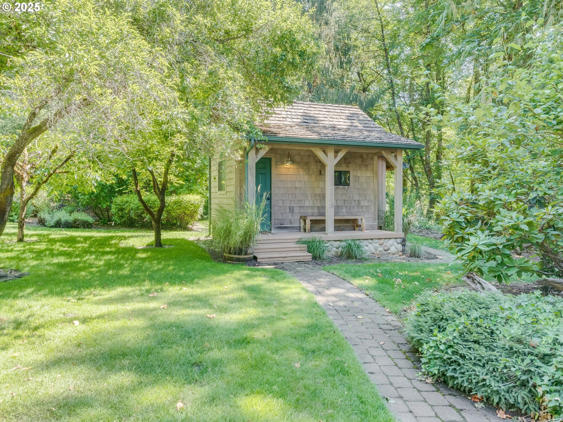 3817 Old Lewis River Road Woodland, WA 98674 - Photo 33 of 48 a view of a brick house with a big yard and large trees