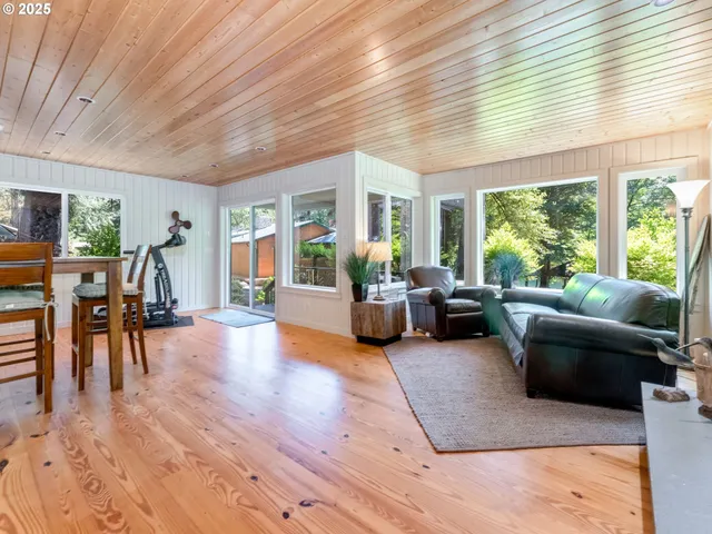 a bedroom with beds and a window