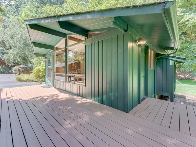 a bedroom with furniture and a flat screen tv