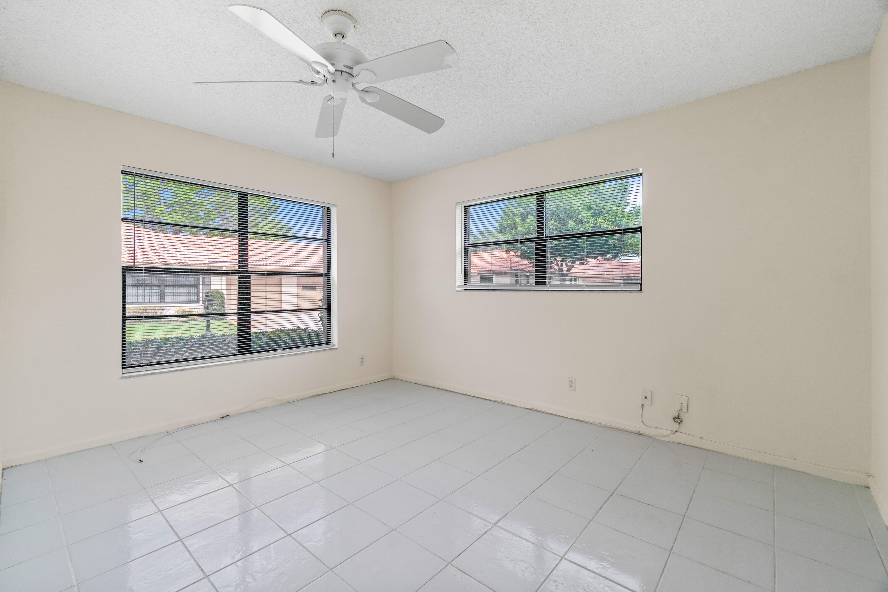 4635 Apple Tree Circle, Unit A Boynton Beach, FL 33436 - Photo 16 of 34 a view of an empty room with a window