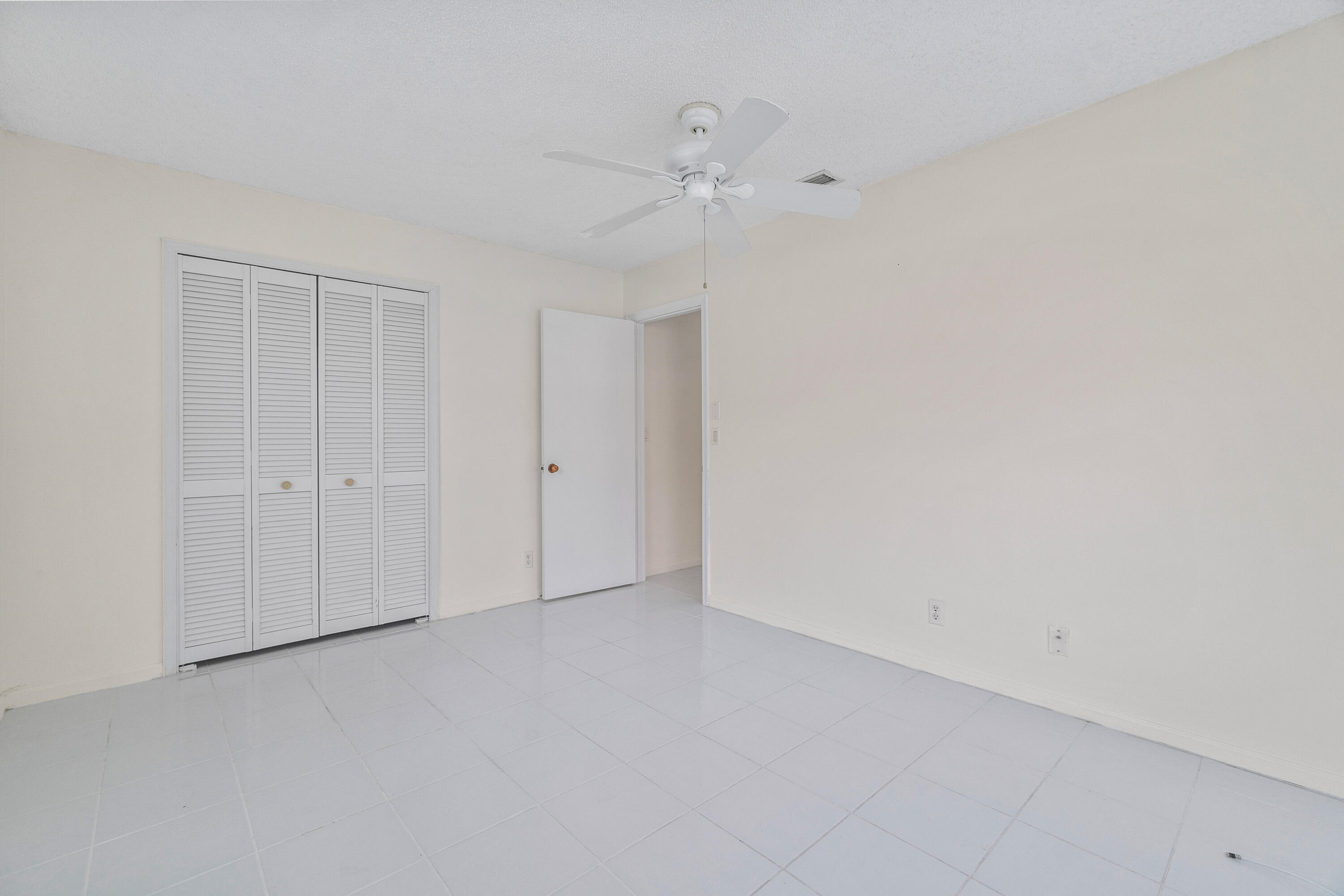 4635 Apple Tree Circle, Unit A Boynton Beach, FL 33436 - Photo 17 of 34 a view of an empty room