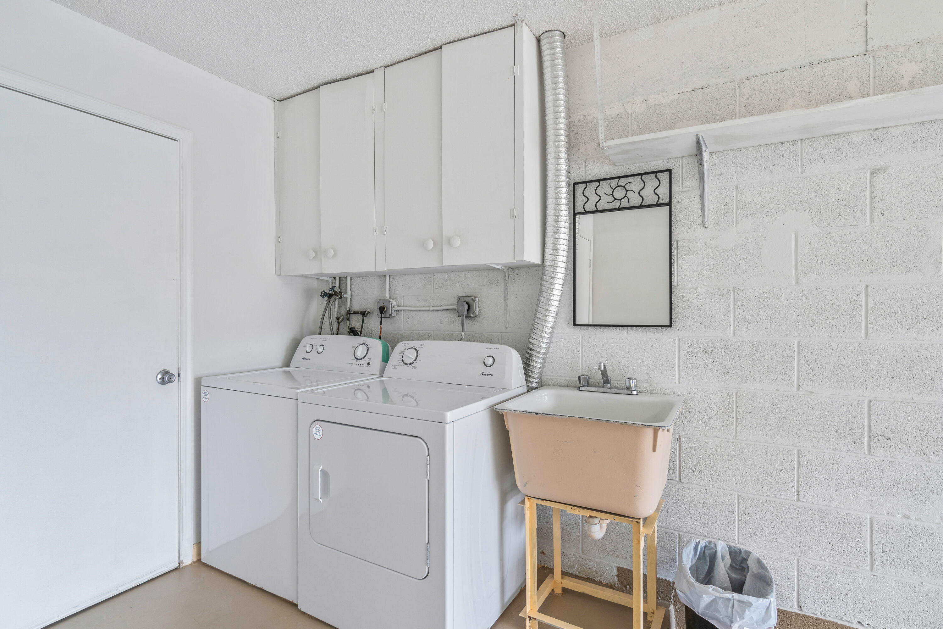 4635 Apple Tree Circle, Unit A Boynton Beach, FL 33436 - Photo 22 of 34 a utility room with dryer and washer