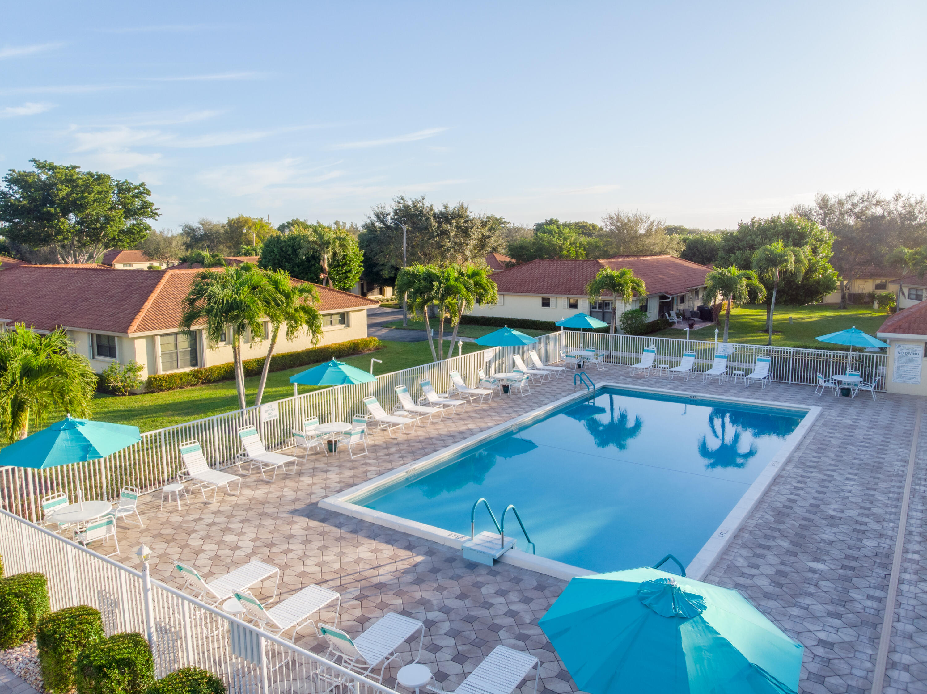 4635 Apple Tree Circle, Unit A Boynton Beach, FL 33436 - Photo 32 of 34 an aerial view of a house with a swimming pool