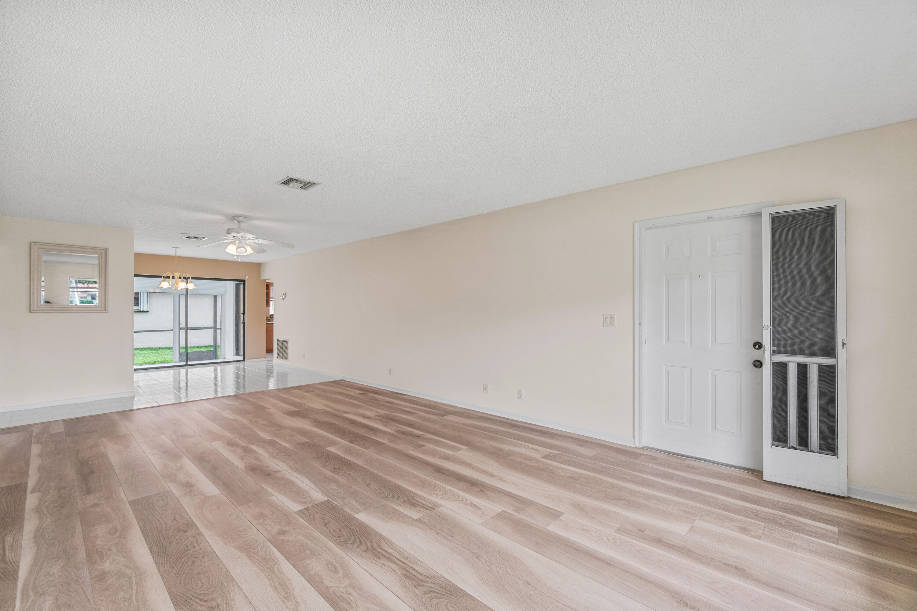 4635 Apple Tree Circle, Unit A Boynton Beach, FL 33436 - Photo 6 of 34 a view of an empty room with a window