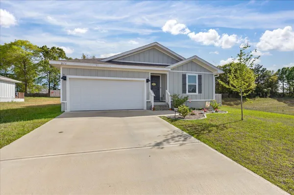 a view of a house with a big yard