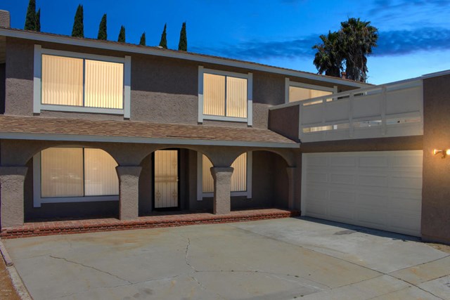 1909 Bardet Place Simi Valley, CA 93065 - Photo 1 of 22 a front view of a house with a garage