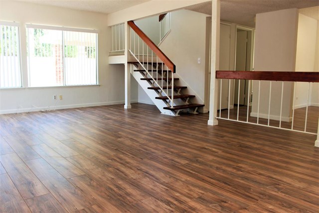 1909 Bardet Place Simi Valley, CA 93065 - Photo 2 of 22 a view of an empty room with wooden floor and a window
