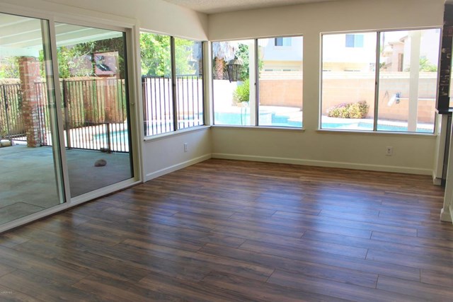 1909 Bardet Place Simi Valley, CA 93065 - Photo 7 of 22 a view of empty room with wooden floor and fan