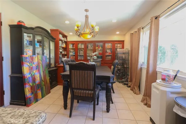 a view of a dining room with furniture window and entryway
