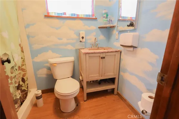 a bathroom with a toilet and a sink