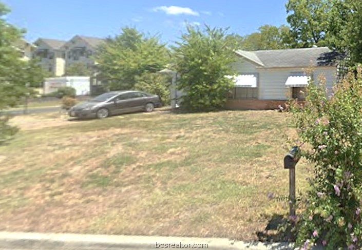 710 Inlow Boulevard College Station, TX 77840 - Photo 1 of 3 a front view of a house with a yard and trees