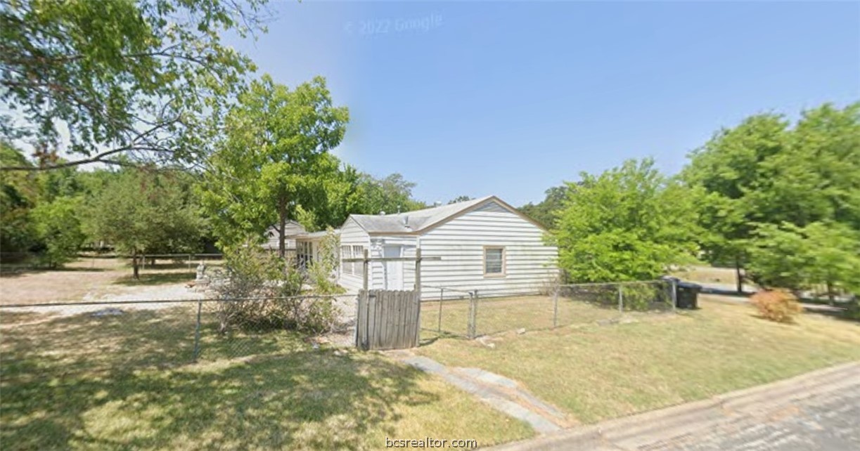 710 Inlow Boulevard College Station, TX 77840 - Photo 2 of 3 a view of a house with a yard and potted plants