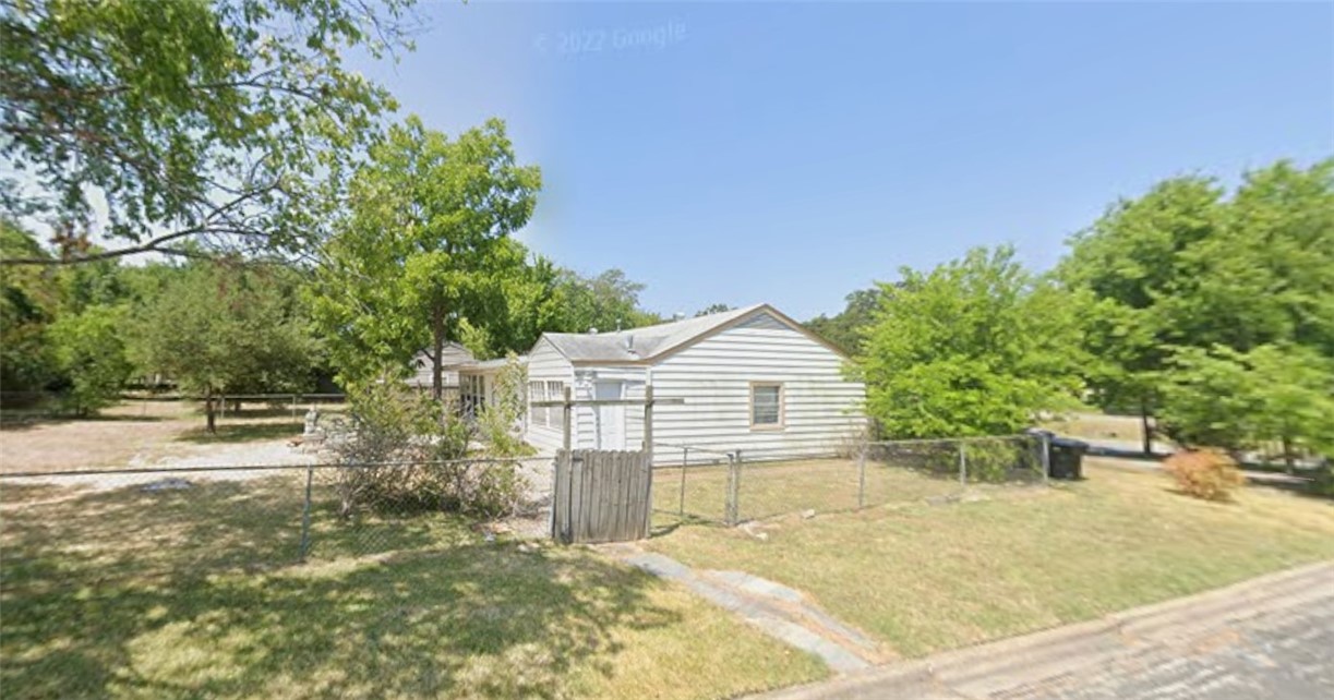 710 Inlow Boulevard College Station, TX 77840 - Photo 3 of 3 a view of a house with a yard and potted plants
